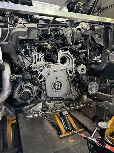 A side profile view of an engine taken from a car. 