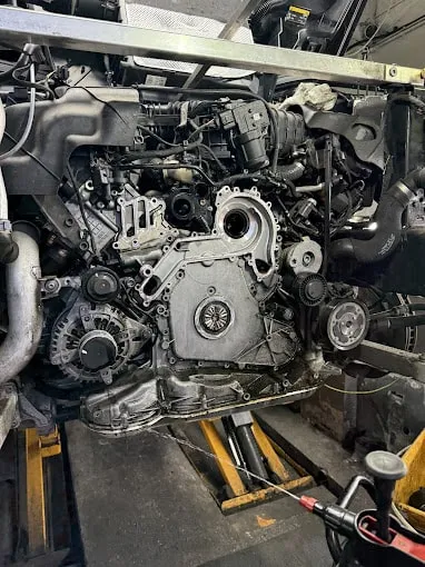 A side profile view of an engine taken from a car. 
