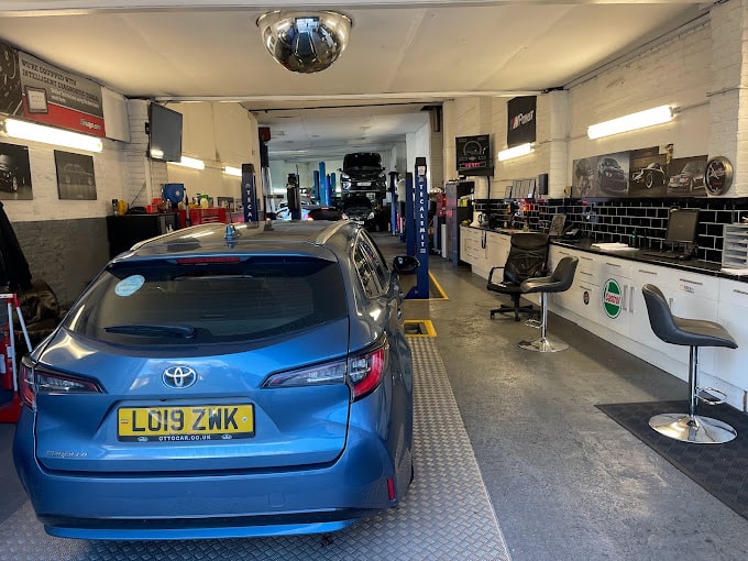 A back view of a blue Hyundai inside the facilities.